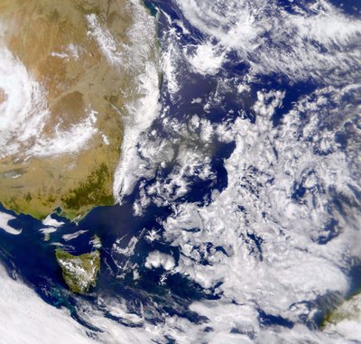 Satellite photograph of the Tasman Sea partially covered by cloud by National Aeronautics and Space Administration National Aeronautics and Space Administration